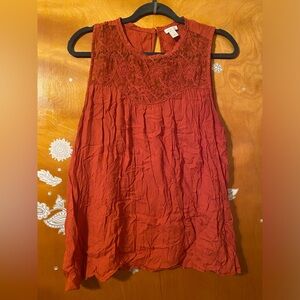 Reddish orange Hinge top. Made in India
